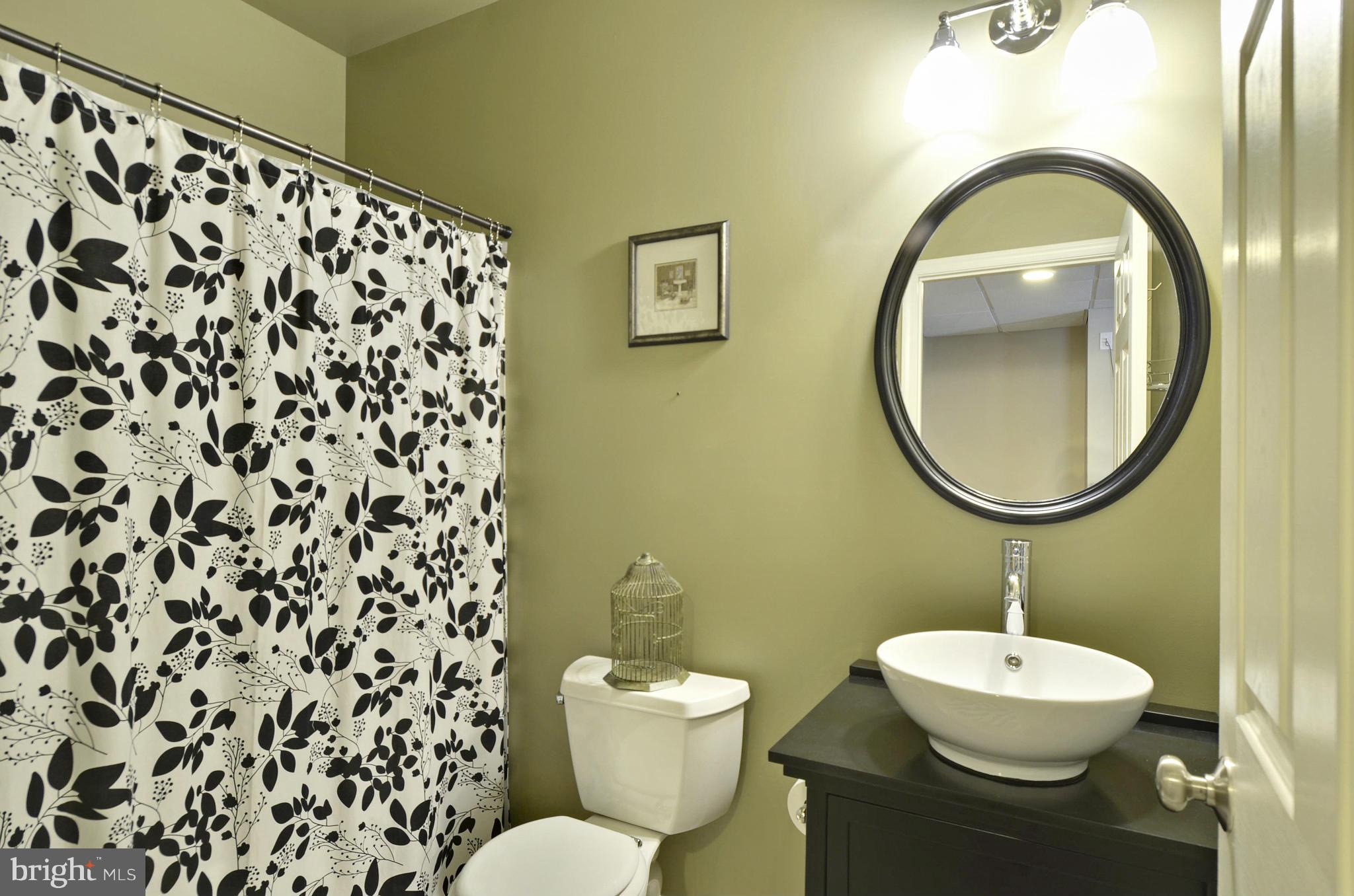 1212 Walker Road Freeland, MD 21053 - Photo 25 of 30 a bathroom with a sink mirror and toilet