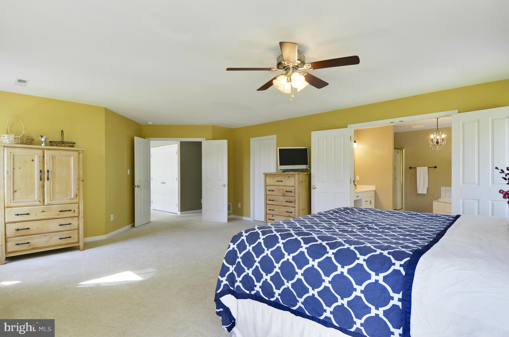 1212 Walker Road Freeland, MD 21053 - Photo 5 of 30 a bedroom with a large bed and dresser