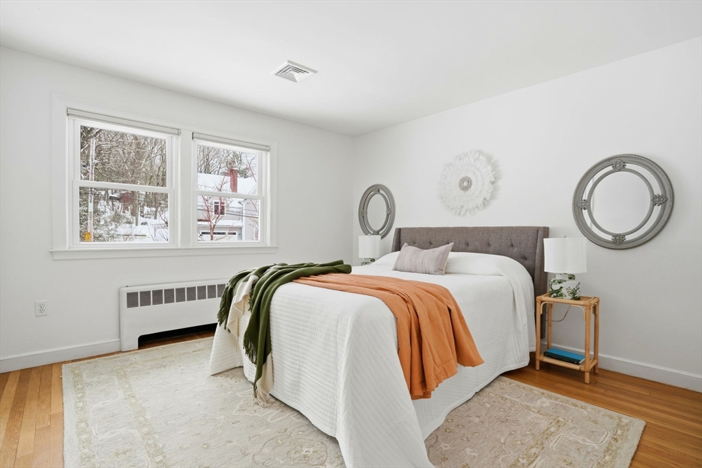 7 Baskin Road Lexington, MA 02421 - Photo 16 of 23 a bedroom with a bed and a window