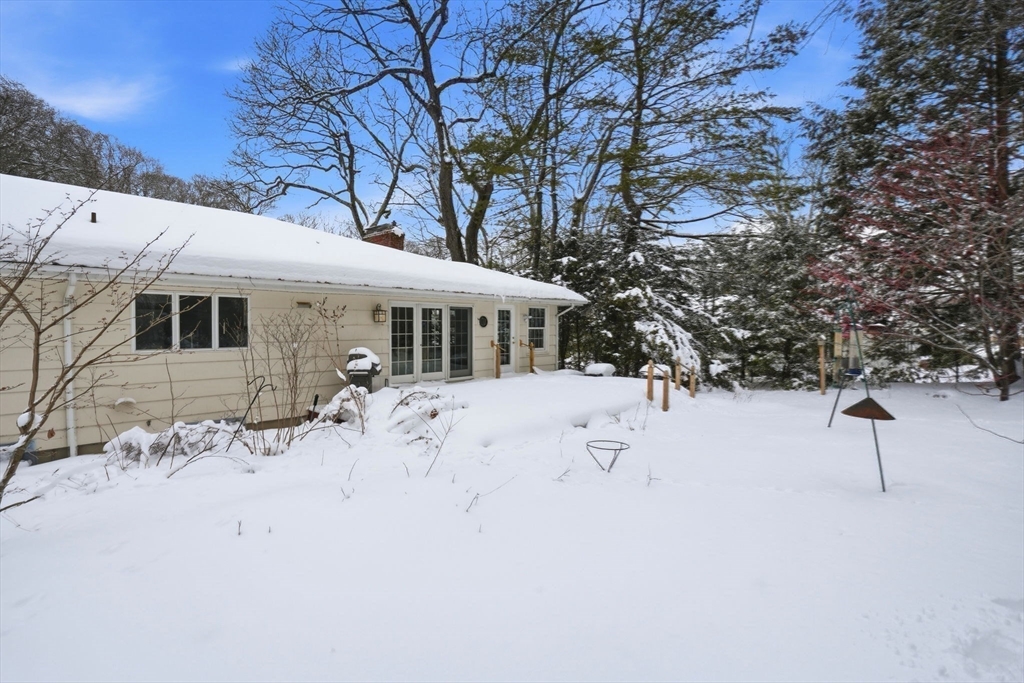 7 Baskin Road Lexington, MA 02421 - Photo 22 of 23 a view of house with a yard covered in snow