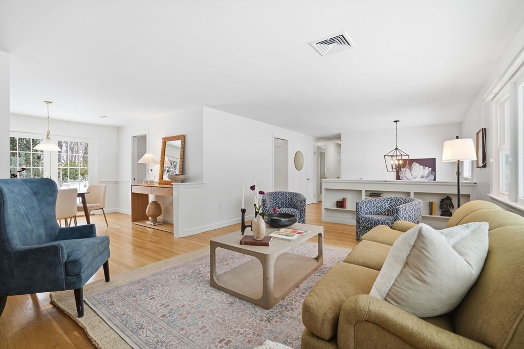 7 Baskin Road Lexington, MA 02421 - Photo 4 of 23 a living room with furniture kitchen view and a table