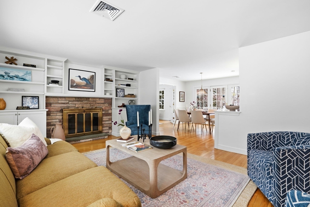 7 Baskin Road Lexington, MA 02421 - Photo 5 of 23 a living room with furniture and a fireplace