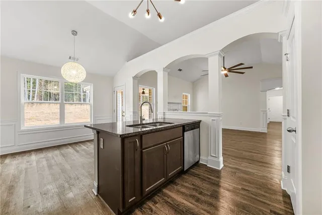 a kitchen with stainless steel appliances granite countertop a stove and a sink