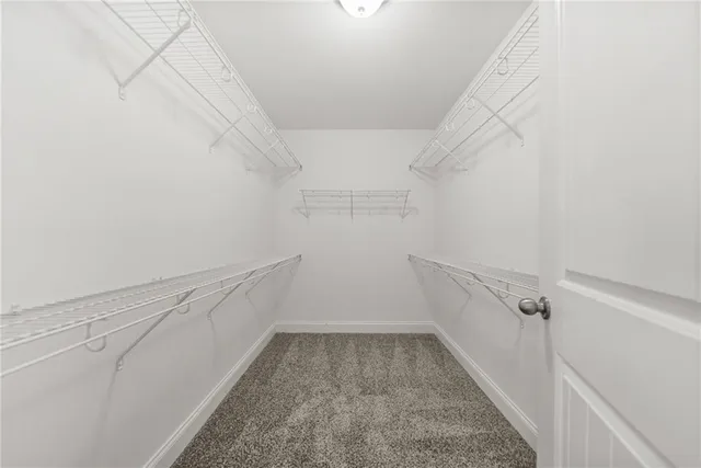 a view of a hallway with white walls