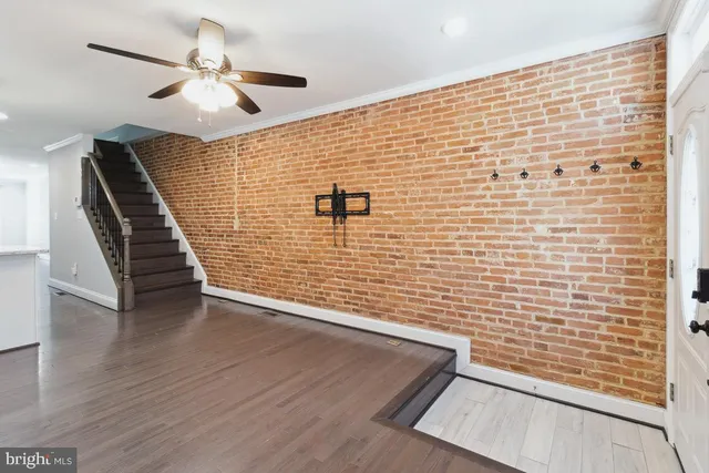 a view of wooden floor with staircase