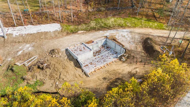 a view of beach and small yard
