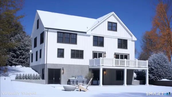 a front view of a house with garage and yard