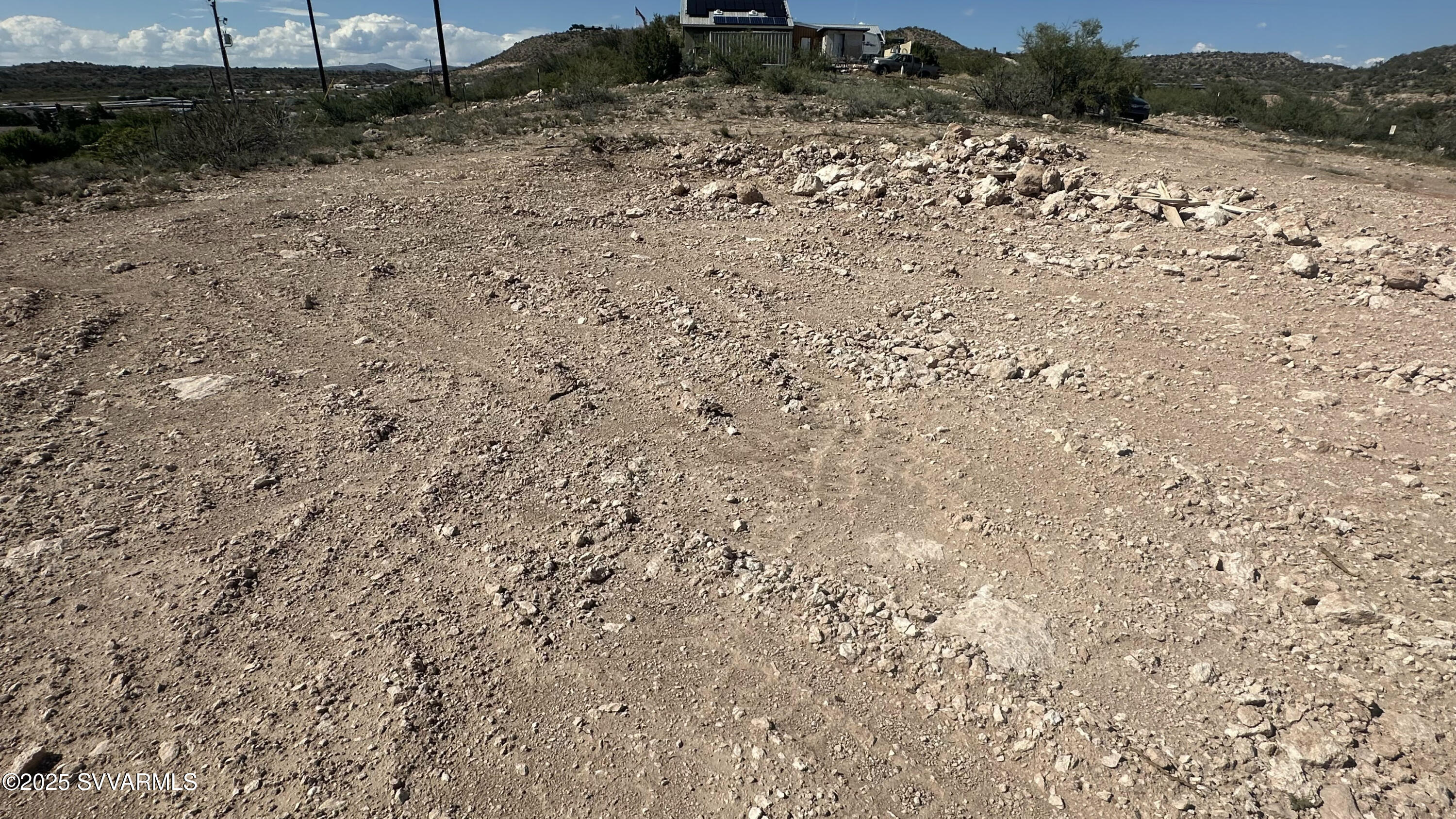 0 East Outlaw Way Rimrock, AZ 86335 - Photo 22 of 69 a view of a dry yard with trees and bushes