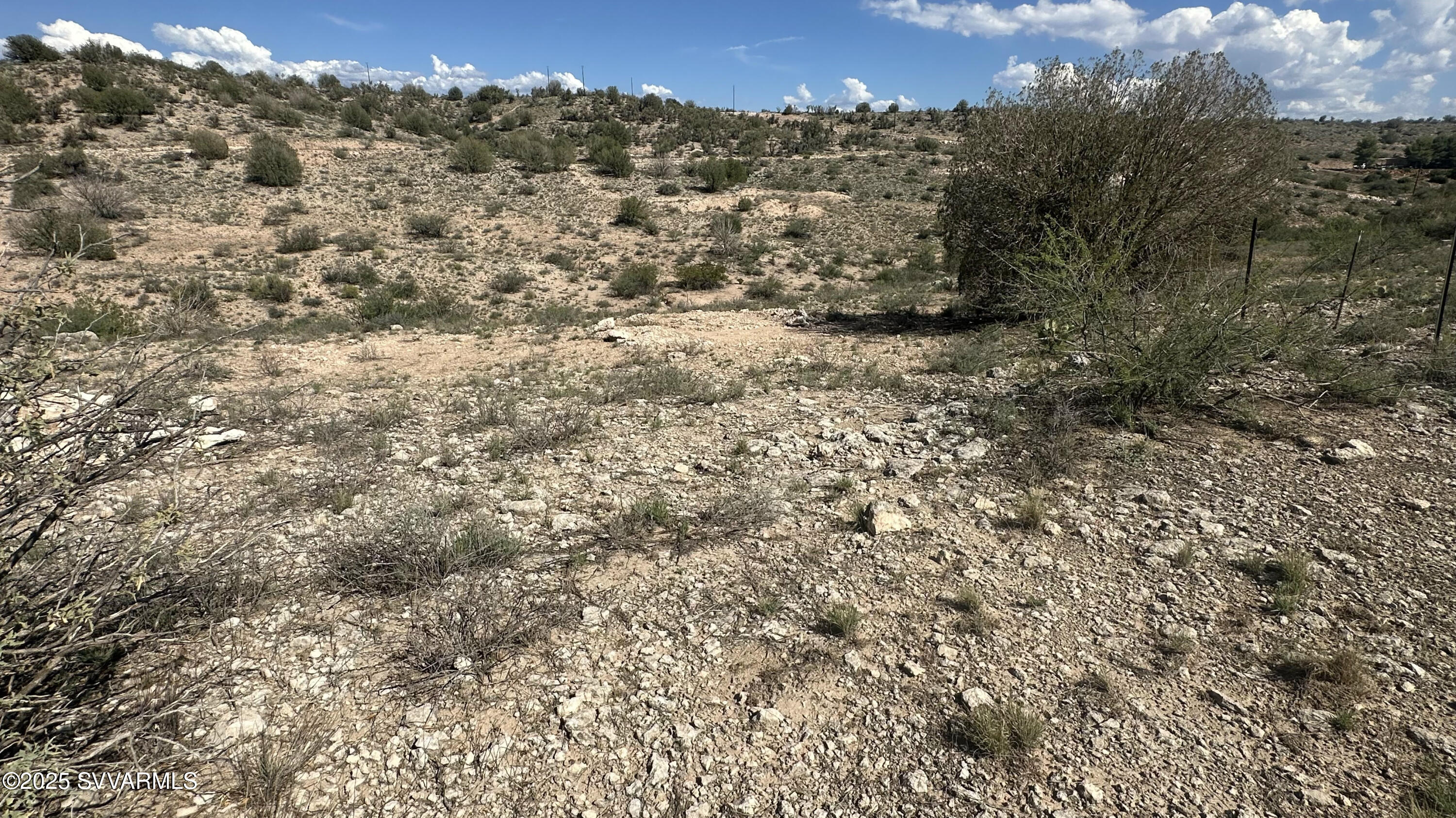 0 East Outlaw Way Rimrock, AZ 86335 - Photo 31 of 69 a view of a forest with a building in the background