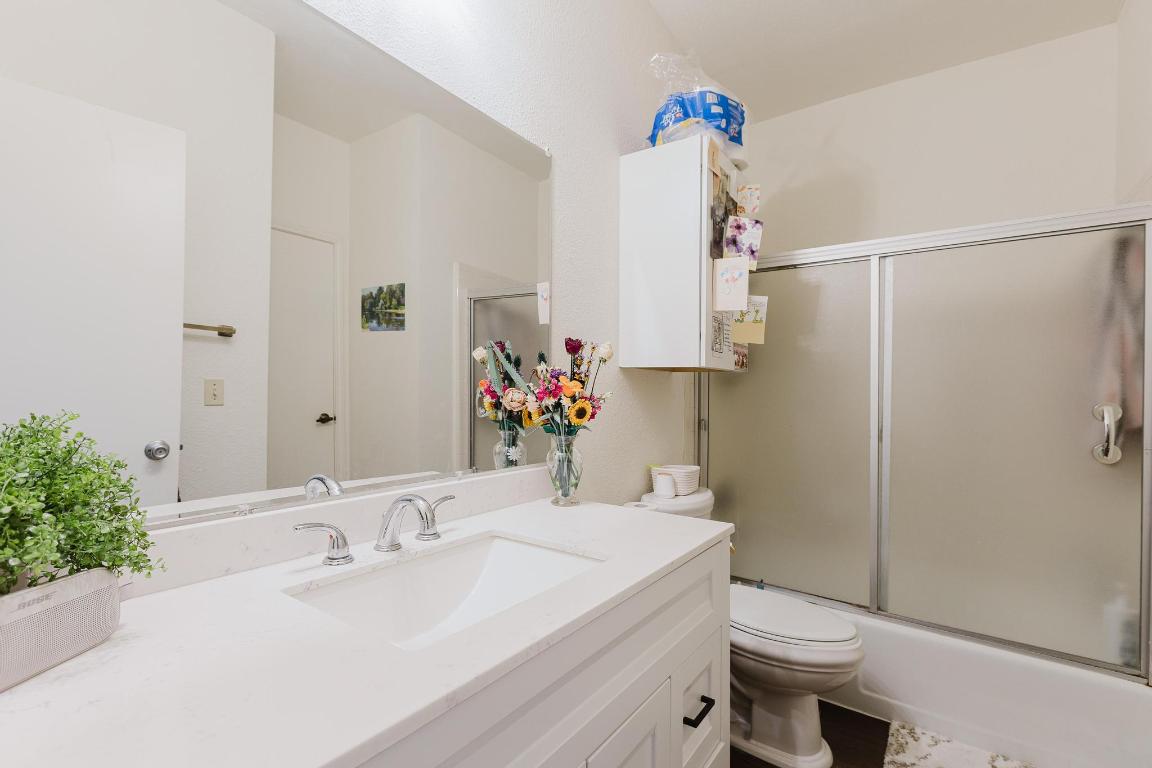 1910 Robbins Place, Unit 207 Austin, TX 78705 - Photo 11 of 28 a bathroom with a sink toilet and shower
