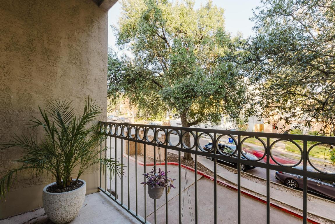 1910 Robbins Place, Unit 207 Austin, TX 78705 - Photo 16 of 28 a view of a street with potted plants