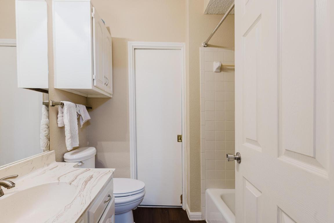 1910 Robbins Place, Unit 207 Austin, TX 78705 - Photo 20 of 28 a bathroom with a sink a toilet and shower