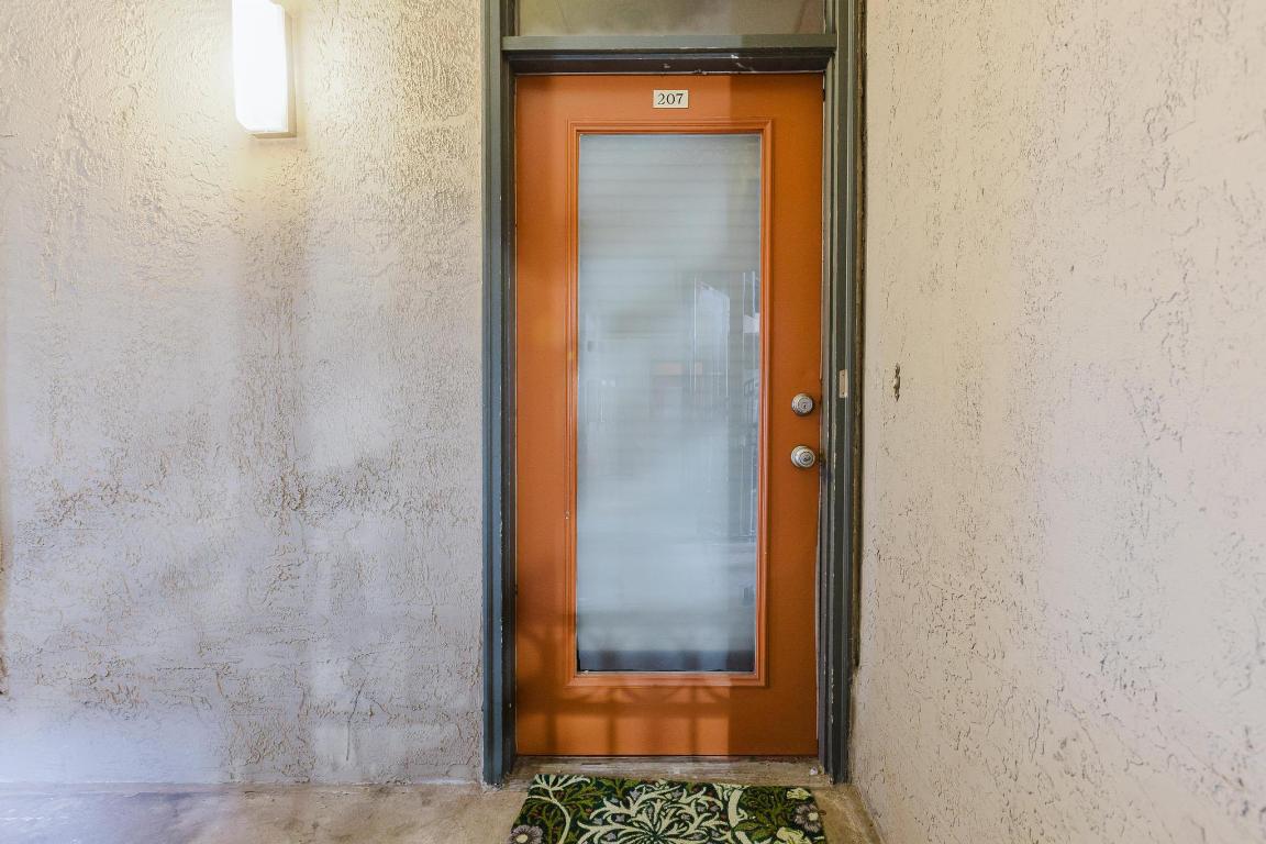 1910 Robbins Place, Unit 207 Austin, TX 78705 - Photo 25 of 28 a bathroom with a door and a shower