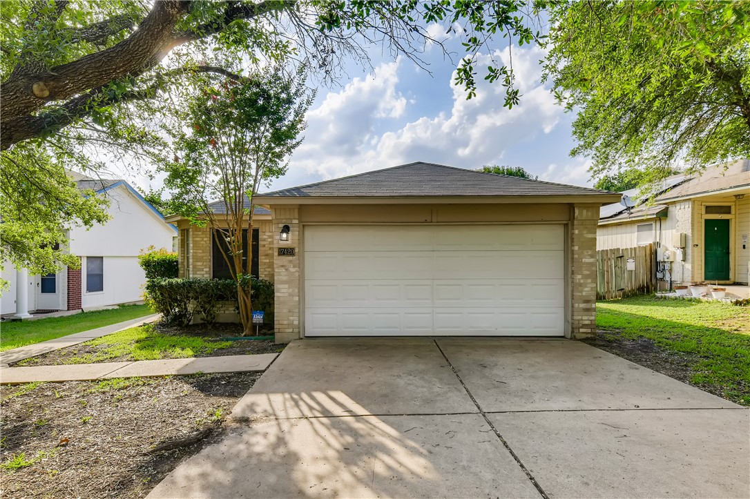 17420 Rannoch Drive Pflugerville, TX 78660 - Photo 1 of 1 a front view of a house with a yard and garage