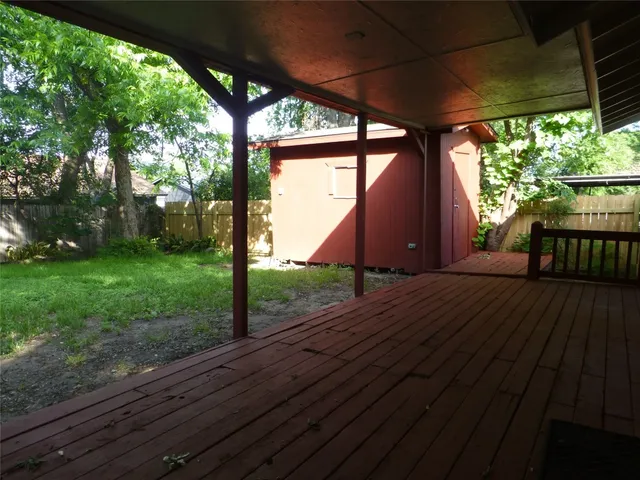 a view of a room with porch and wooden floor