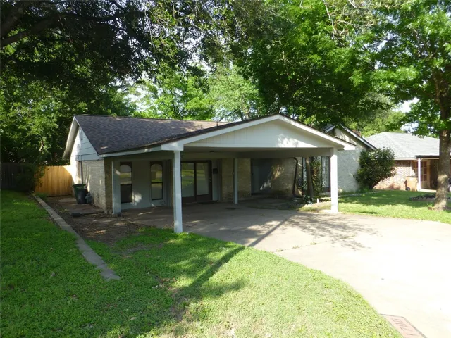 a front view of a house with a yard and porch