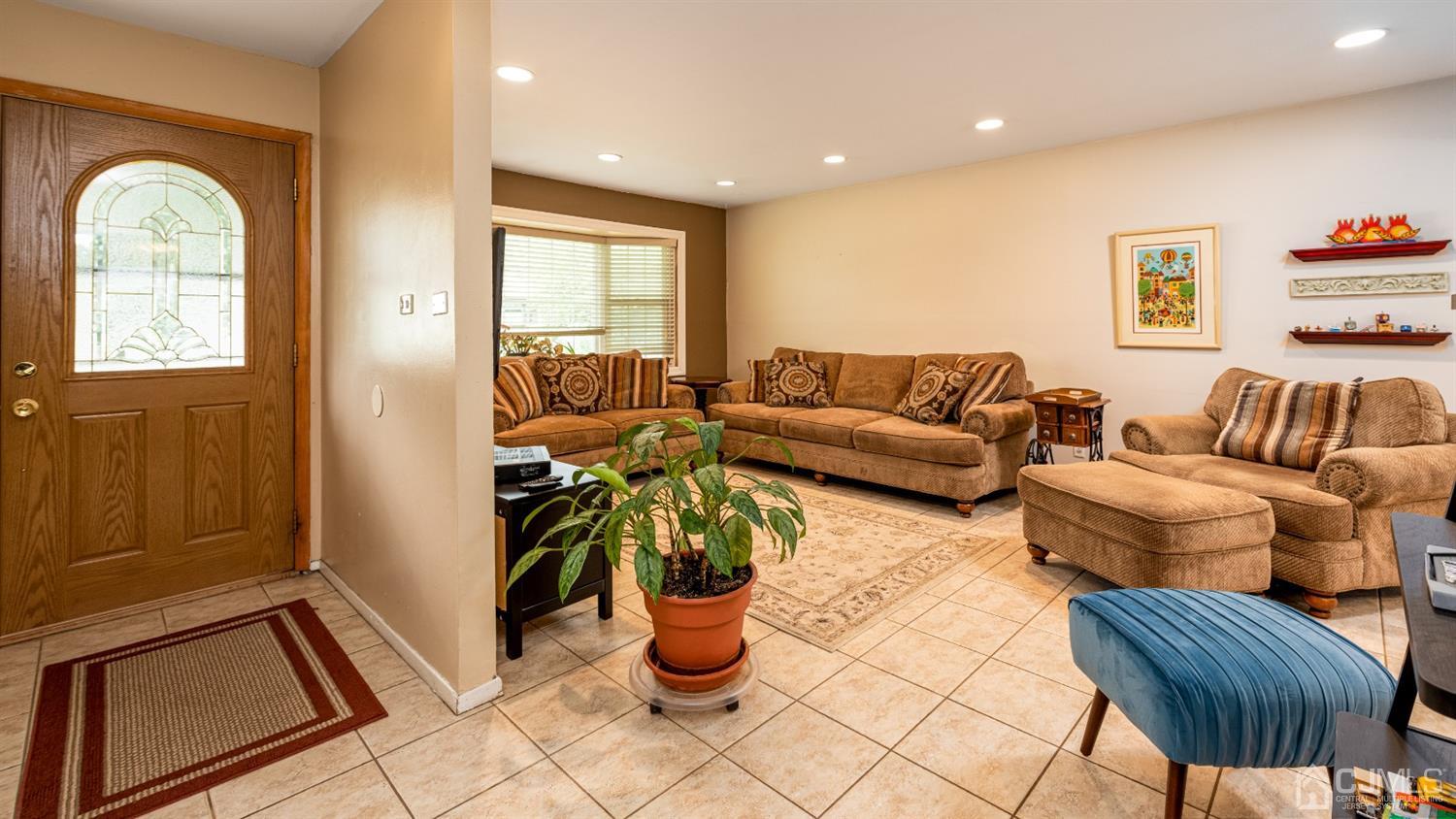 35 Larchmont Road Edison, NJ 08837 - Photo 2 of 23 a living room with furniture and a window