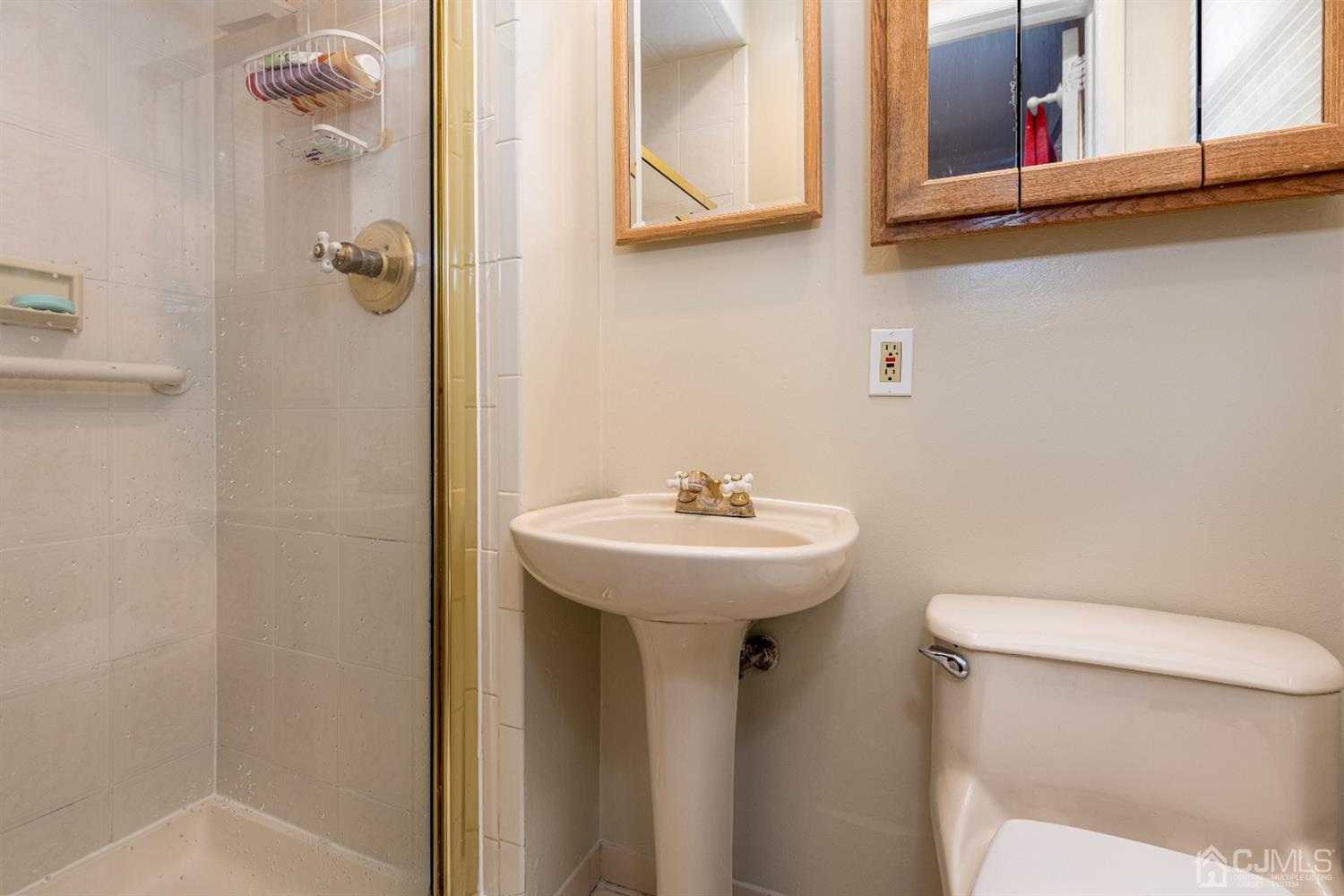 35 Larchmont Road Edison, NJ 08837 - Photo 13 of 23 a bathroom with a sink a toilet and shower