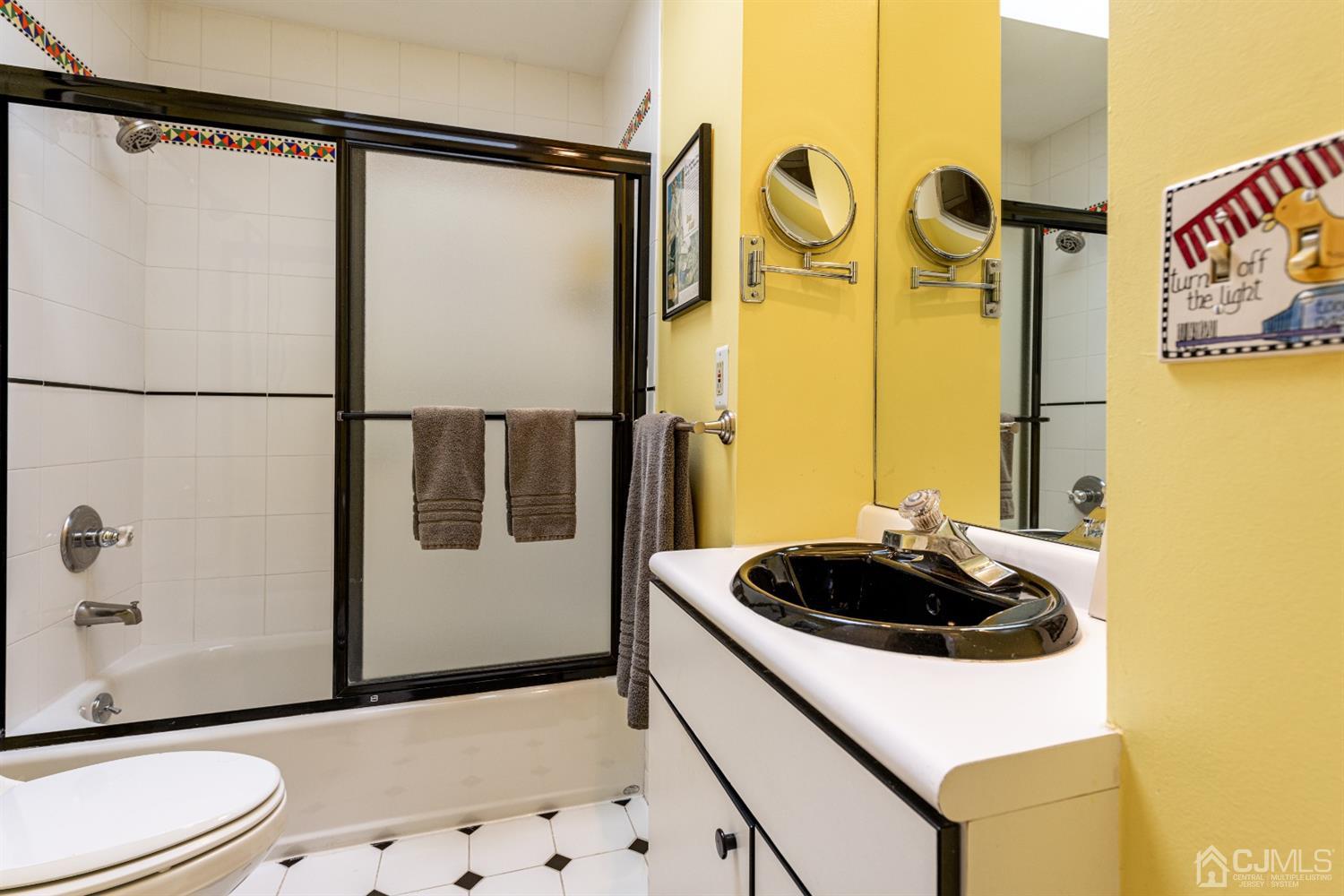 35 Larchmont Road Edison, NJ 08837 - Photo 16 of 23 a bathroom with a sink and a mirror
