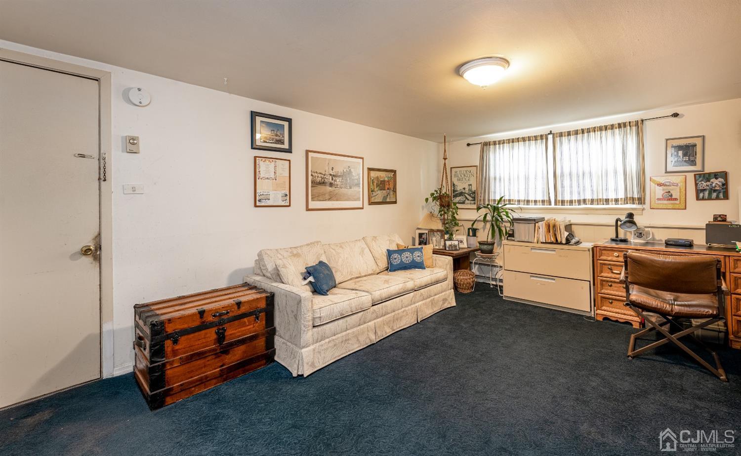 35 Larchmont Road Edison, NJ 08837 - Photo 17 of 23 a living room with furniture and a window