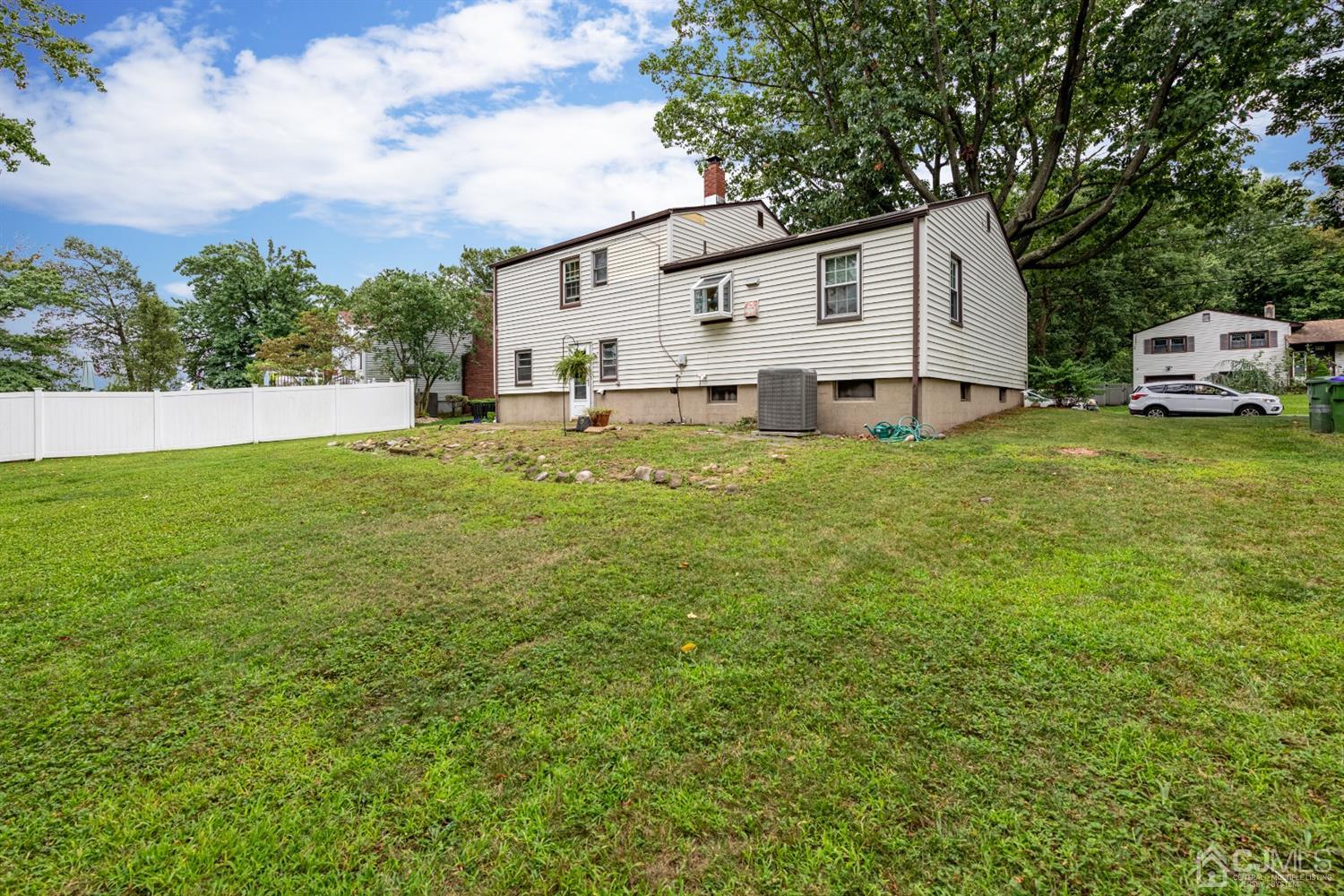 35 Larchmont Road Edison, NJ 08837 - Photo 20 of 23 a bathroom with a sink and a yard