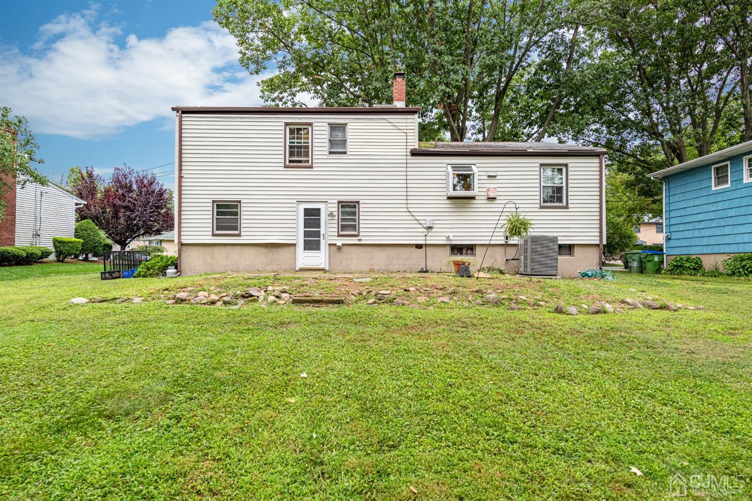 35 Larchmont Road Edison, NJ 08837 - Photo 21 of 23 a front view of house with yard and seating area