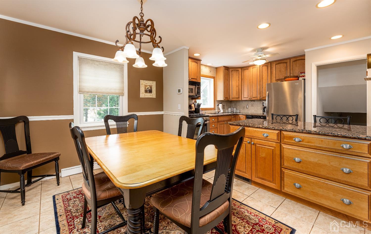 35 Larchmont Road Edison, NJ 08837 - Photo 6 of 23 a dining table chair with a large window