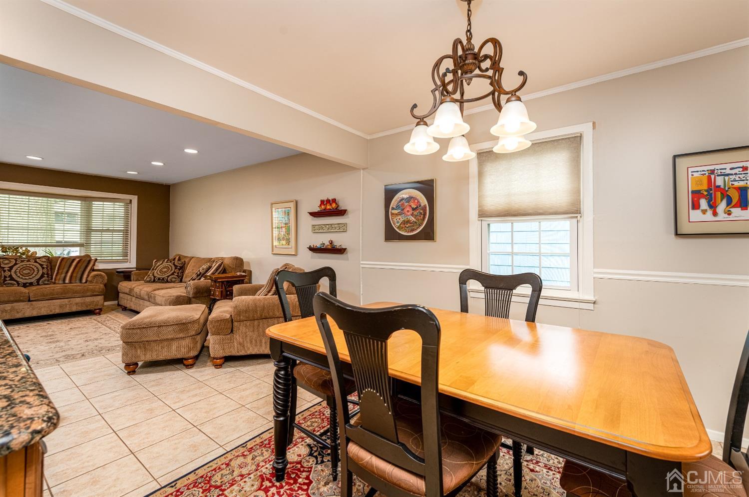 35 Larchmont Road Edison, NJ 08837 - Photo 7 of 23 a living room with furniture a chandelier and a window
