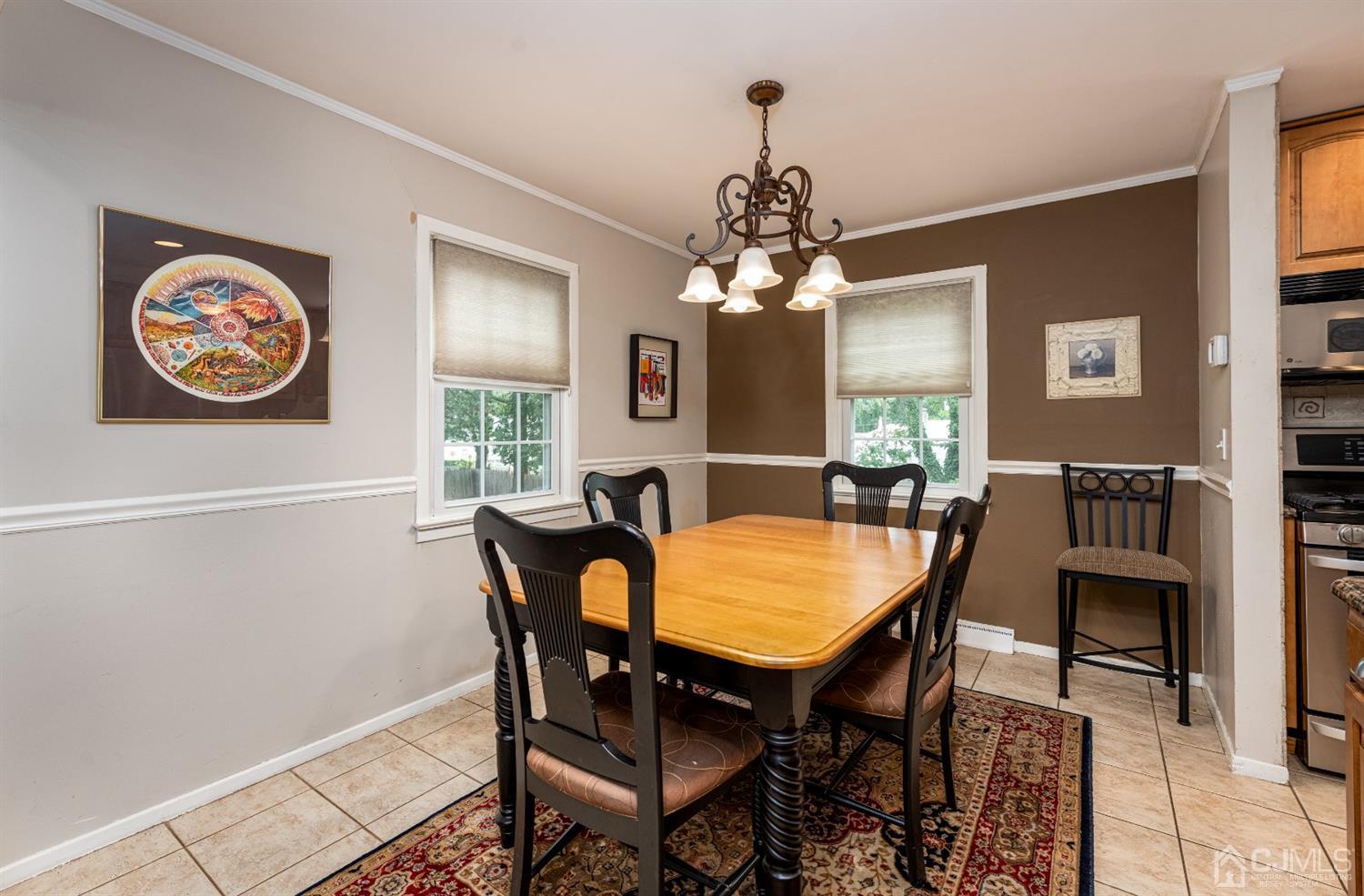 35 Larchmont Road Edison, NJ 08837 - Photo 8 of 23 a view of a dining room with furniture and chandelier