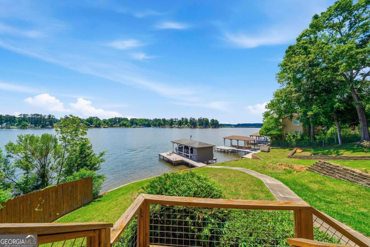172 Mays Road Milledgeville, GA 31061 - Photo 3 of 54 a view of a swimming pool with a lake view