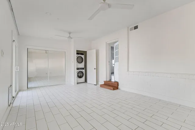 a view of a room with a flat screen tv