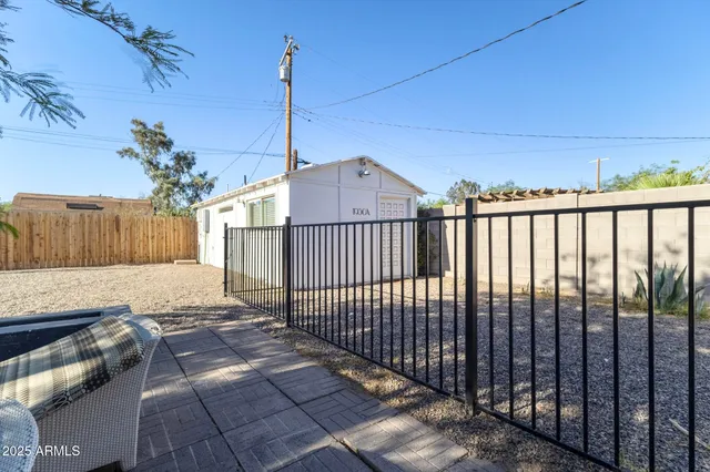 a view of a roof deck with wooden fence