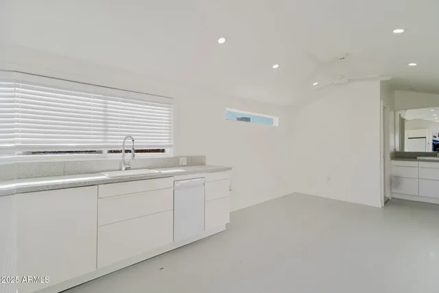 a view of cabinets and a sink