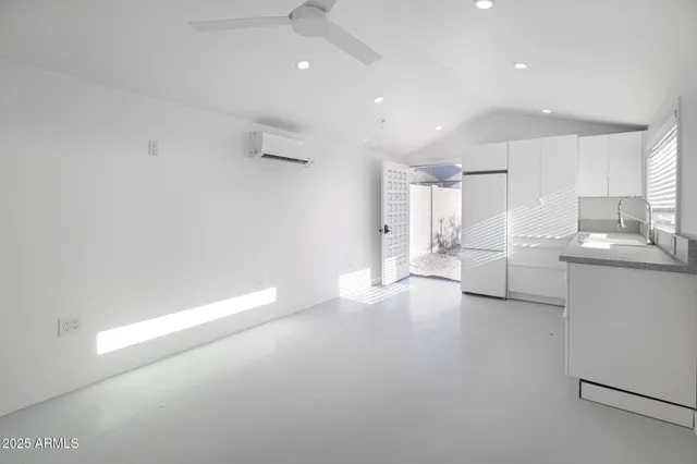 a view of an empty room and window