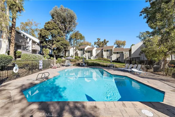a view of a swimming pool with outdoor seating