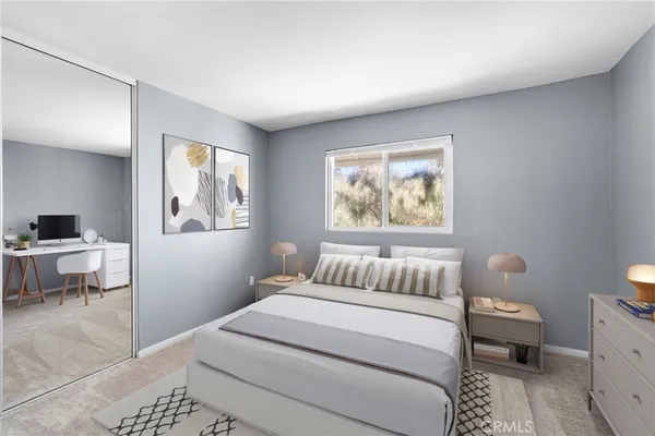 a bedroom with a bed and a couch