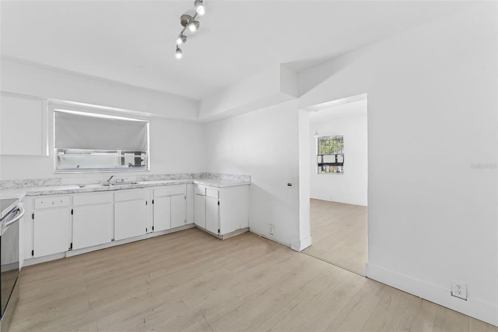 3102 West Leroy Street, Unit A Tampa, FL 33607 - Photo 11 of 21 a view of a kitchen with sink cabinets and wooden floor