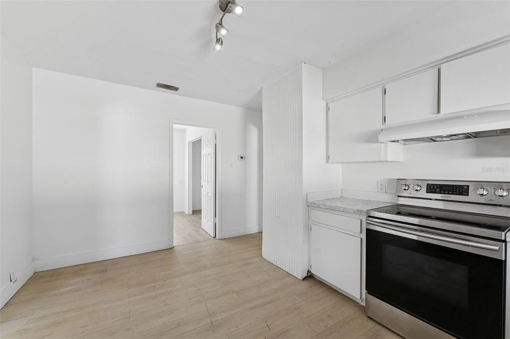 3102 West Leroy Street, Unit A Tampa, FL 33607 - Photo 12 of 21 a kitchen with a stove and a refrigerator
