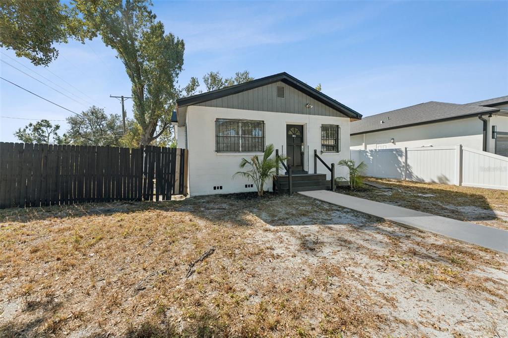 3102 West Leroy Street, Unit A Tampa, FL 33607 - Photo 4 of 21 a view of a house with backyard and trees