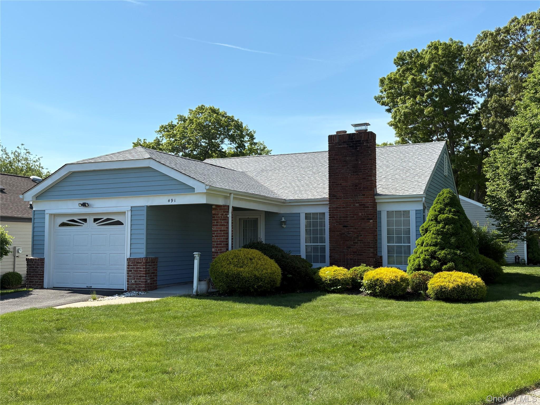 491 Stratford Lane Ridge, NY 11961 - Photo 1 of 24 a view of a house with backyard and a tree