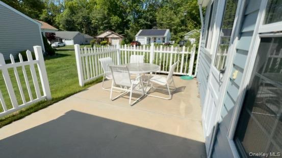 491 Stratford Lane Ridge, NY 11961 - Photo 20 of 24 a view of balcony with furniture