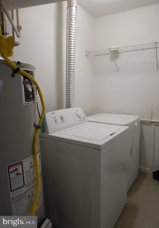 a bathroom with a toilet a sink and bathtub