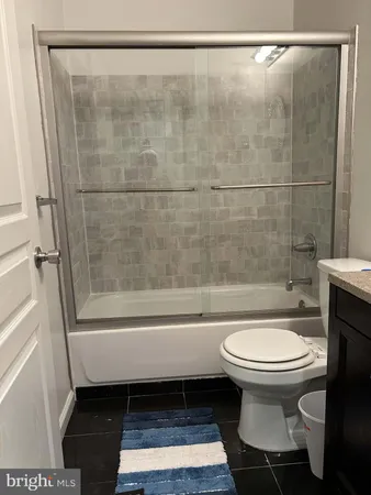 a bathroom with a toilet a sink and bathtub