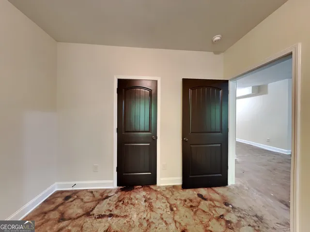 a view of a big room with closet and wooden floor
