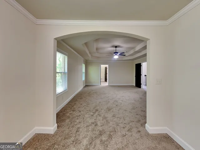 a view of an empty room and window