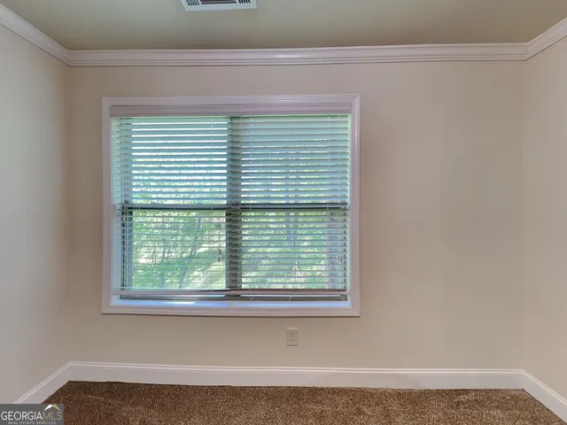 a view of a room that has a window in it