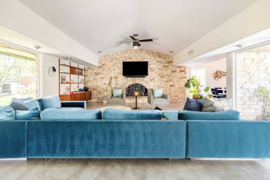 6102 Cherrylawn Circle Austin, TX 78723 - Photo 1 of 1 a living room with furniture and a flat screen tv