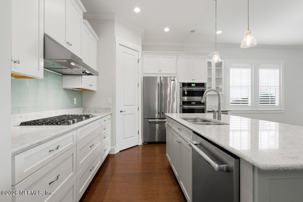 569 Timber Bridge Lane Atlantic Beach, FL 32233 - Photo 19 of 81 a kitchen with stainless steel appliances granite countertop a sink a stove and a refrigerator