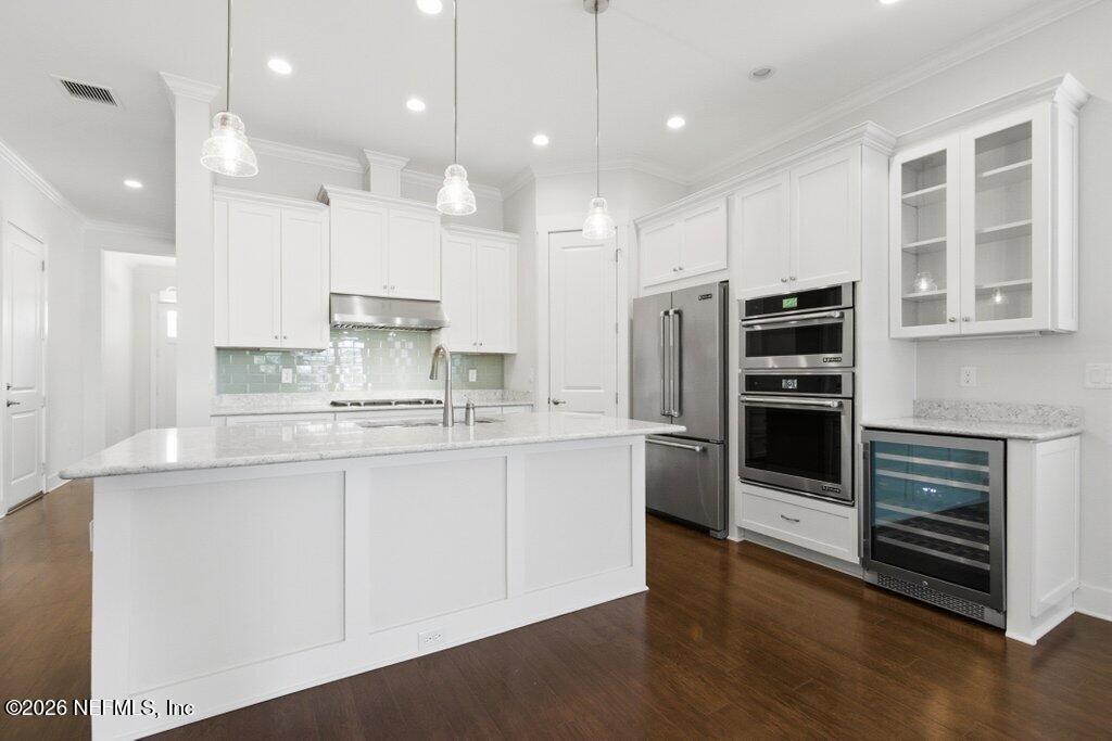 569 Timber Bridge Lane Atlantic Beach, FL 32233 - Photo 20 of 81 a kitchen with stainless steel appliances kitchen island granite countertop a stove a sink and a refrigerator