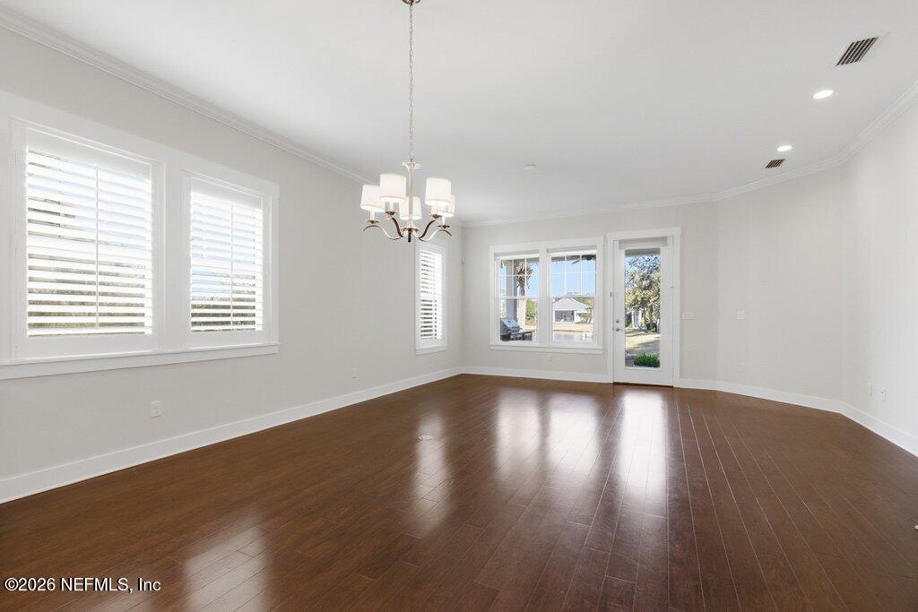 569 Timber Bridge Lane Atlantic Beach, FL 32233 - Photo 26 of 81 a view of a chandelier and wooden floor